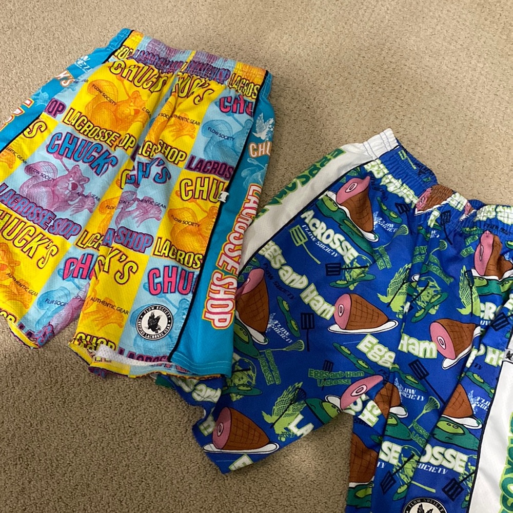 2 pairs Flow Society youth medium lacrosse shorts